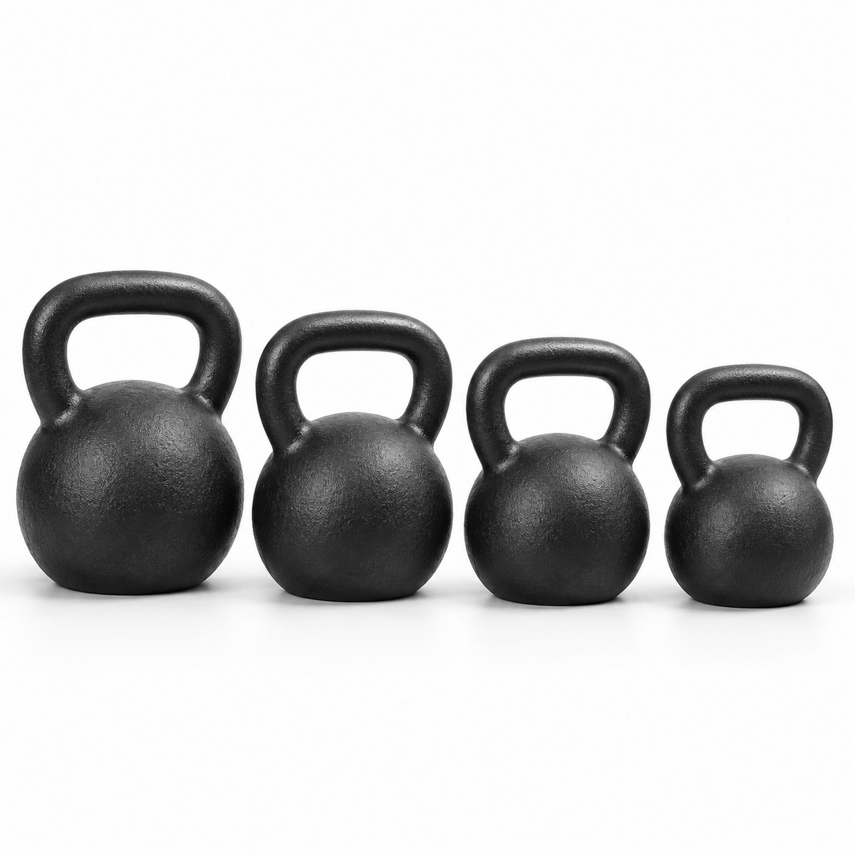Four unbranded cast-iron kettlebells representing the York Hercules Progression package: 70, 60, 50, and 45 lb.